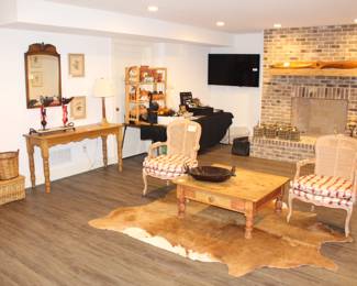 Striped chairs, table, propeller and cowhide rug sold.