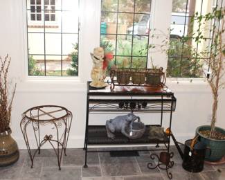 ALL ITEMS SOLD EXCEPT THE WROUGHT IRON PLANT STAND. Large amount of garden items.