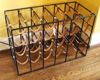 Iron and leather strap wine rack.