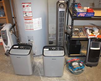 Portable radiator heater. Two dehumidifiers, tower fan and space heater. (Tower fan sold.)