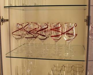 Red wine swirl glasses and other glassware.