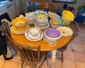 kitchen table with 4 chairs and LOTS of china