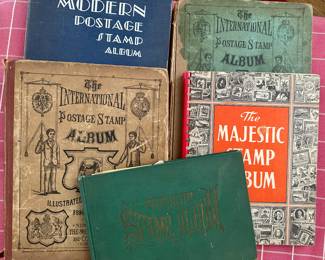 Vintage stamp collecting books - sparsely filled.