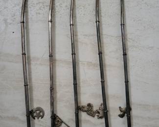 Antique sterling juilep with mint leaf straws.