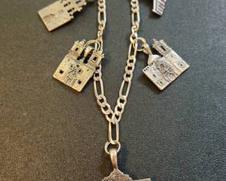Sterling Figaro chain with mission charms from the 1980s