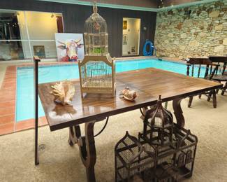 One of two Trestle tables. House is built around an enclosed swimming pool