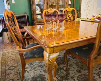 Large table with to leave with two leaves,  eight chairs.  Excellent condition. Dragonfly upholstered seats.