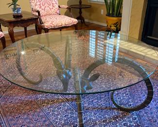 Glass top coffee table  w/ brass antelope horn