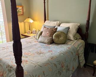 Carved wood four poster queen bed and bedding