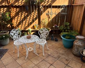 Bistro patio set and many plants