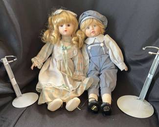 Two Dolls In Light Blue Clothes 