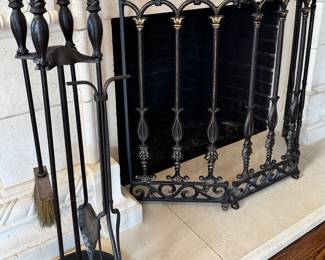 Fireplace tools and decorative guard.