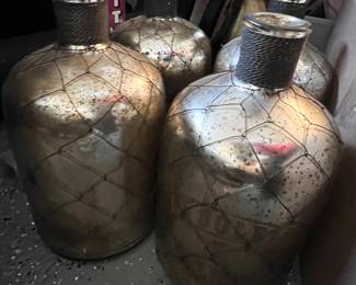 57. Four "Le Soleil Malines" Mercury Glass Bottle 