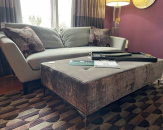 Black alligator skin tray, Thayer Coggin grey velvet ottoman, Linque Collection floor lamp, Modern three-seat sofa
