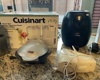 GT X Press 101 grill, Chefman Air Fryer RJ38V335T, Black and Decker Power Pro hand mixer, Cuisinart ice cream maker
