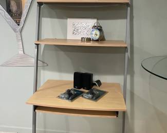Wall shelf desk, Bose Acoustimass subwoofer and double speakers, Twenty Bird clock, Ashtray
