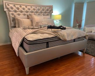 Walter E. Smithe metallic silver king bed, Various pillows, Black bottom metal tray, Mirror jewelry box, New with tags men's Under Armour clothing (size medium)