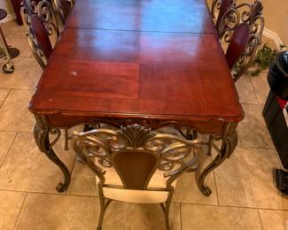 $425- LARGE CARVED WOOD AND METAL TABLE WITH SIX CHAIRS AND ONE LEAF~(DELIVERY AVAILABLE)