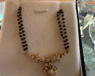 $725~ 14KT DIAMOND AND AND ONYX NECKLACE