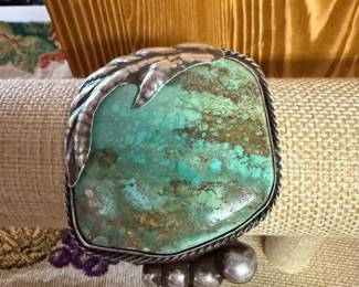 $1250- ABSOLUTELY VINTAGE AMAZING NAVAJO STERLING CUFF BRACELET WITH HAND TOOLED WORK INCASING A LARGE RARE GREEN TURQUOISE STONE