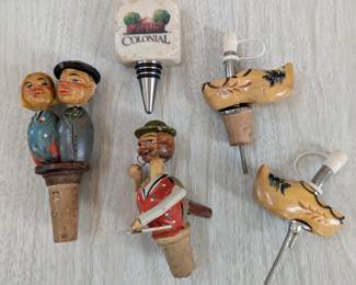 Wood carved wine stoppers