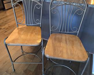 Two wood seat metal frame barstools
