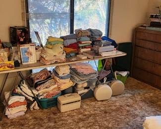 Sweaters, towles,  sewing and knitting items, shower seat, walker, old patterns 