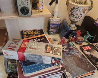Dungeons and dragons  cards, stacks of magazines 