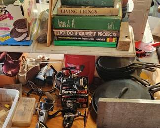 Fishing reels,  vintage poker chips in a tin carrier 