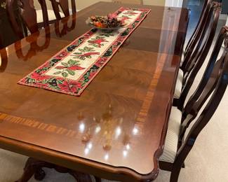 Mahogany dining table with double pedestal with claw-footed legs, 3 leaves with pads, and 8 dining chairs (2 armchairs and 6 side chairs)