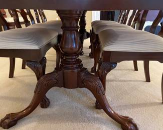 A view of the dining table pedestal with claw-foot
