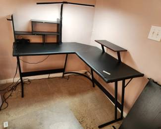 #87	Black L shaped computer desk with working lamp and power outlet metal legs 52x52x29x20	 $125.00 
