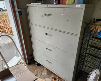 #58	4 Drawer legal size file cabinet on wheels	 $35.00 
