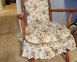 #103	Small vintage wood with metal springs rocker with flora cushions 21" seat length 14" seat height	 $30.00 
