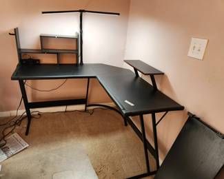 #87	Black L shaped computer desk with working lamp and power outlet metal legs 52x52x29x20	 $125.00 
