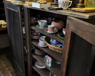 Pie safe filled with tchotchkes 