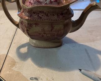 Several antique teapots