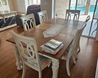 Measure 70 in by 42 in with the leaf. $450