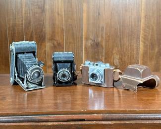 (3pc) Film Cameras | Including a Zeiss Ikon camera, a Primus Prontor II, and an Olympus 35 in leather case.