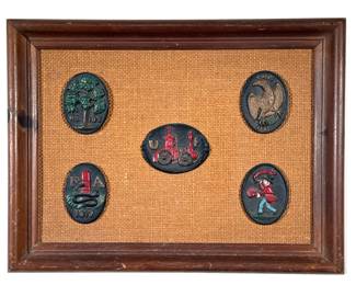 Framed Metal Plaques | Cold painted plaques on a woven jute backing in a wood frame, including an "FA" plaque dated 1817 and an "I.N.A." eagle plaque dated 1792 - h. 12.25 x w. 16 in (overall)