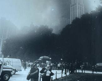 FRANK RITTER (American, 1946-2023) PHOTOGRAPH | September 11, 2011. Women walking before the dust cloud of the towers. h. 19.5 x 15 in., sight - h. 32 x w. 21 in (frame)
