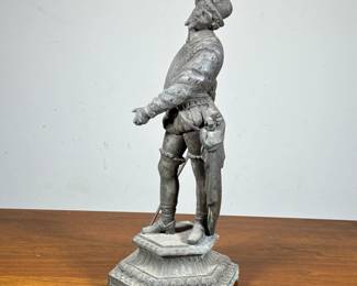 Cast Metal Statue | Statue of a gentleman in armor and feathered hat with a fencing sword. - h. 16.5 x w. 6.5 in
