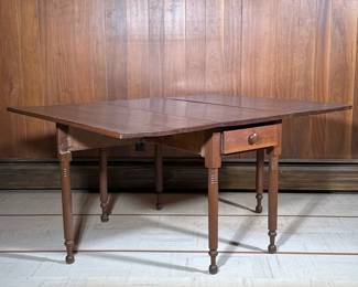 ANTIQUE MAHOGANY DROP LEAF TABLE | Drop leaf extending mahogany table with folding legs and a drawer. - h. 30 x w. 60 x l. 46 in
