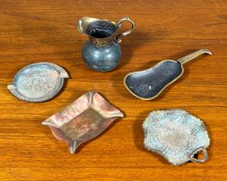 (5pc) Metal Vessels | Including a guitar form dish, a hammered copper dish or ashtray, two small Israeli dishes, and a patinated pitcher of small size. - h. 3.5 in (pitcher)
