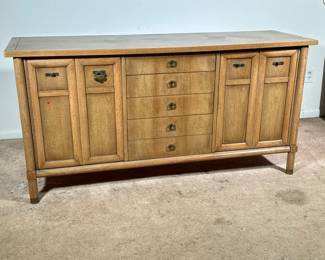 Mid-century Sideboard | American of Martinsville mid-century modern sideboard console cabinet with two bifold cabinet doors centering a bank of five drawers. - h. 32 x l. 64 x d. 20.25 in