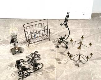(5pc) IRON AND METAL ITEMS | Including a three-arm wall sconce, a hurricane shade lamp, a magazine rack, and two standing candelabra. - h. 22 in (tallest)
