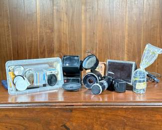 Group Camera Accessories | A large group of camera and photography accessories, including lenses, filters, etc.
