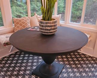 Black metal Restoration Hardware dining table, 48" across