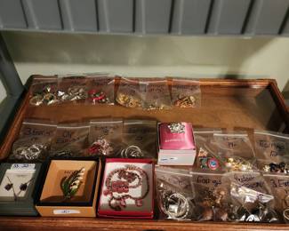 Many broochs and earrings.  Many sold 3 to a bag  for between $8 - $14 a bag!