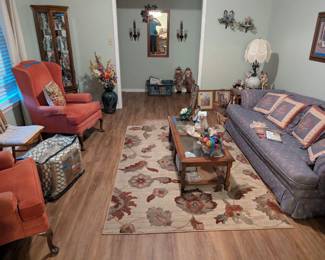 Another sofa, rug, coffee table and end tables.